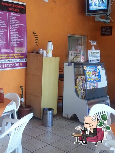 Sente em uma das mesas no Restaurante Predilleto
