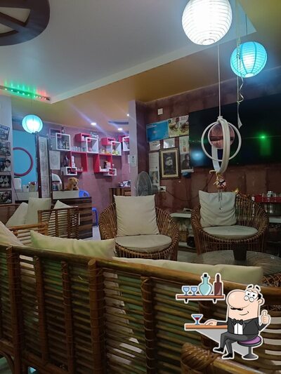 Take a seat at one of the tables at Adda cafe