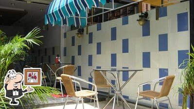 Take a seat at one of the tables at Chettiar Rolls