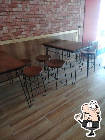 The interior of O Chicken India - Oil Free Healthy Chicken