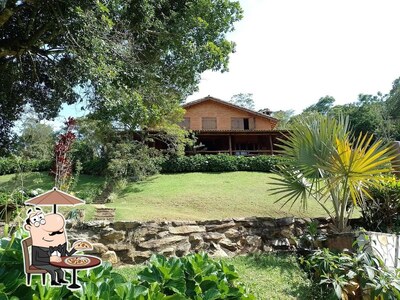 Desfrute da vista da área externa do Pousada Alto dos Manacás