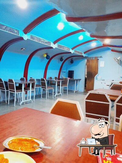 Take a seat at one of the tables at Khana
