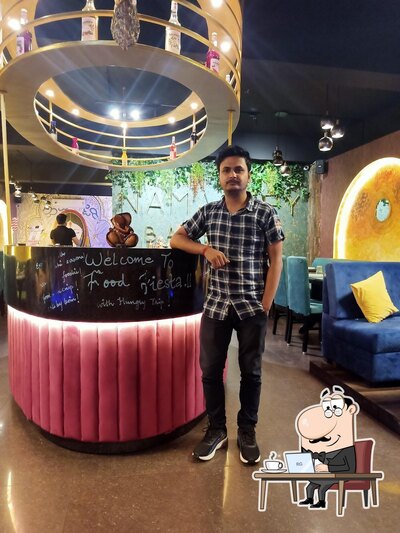 Take a seat at one of the tables at NAMASTEY BAREILLY