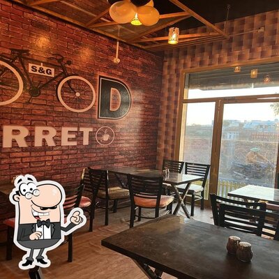 Take a seat at one of the tables at Food Arret