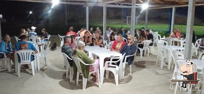 Sente em uma das mesas no CHURRASCARIA SITIO KALK