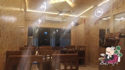 Take a seat at one of the tables at Pine wood restaurant