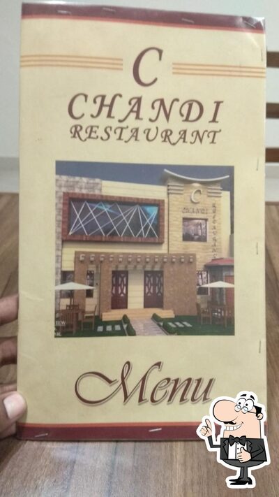 The advertisement shows information about Chandi Restaurant