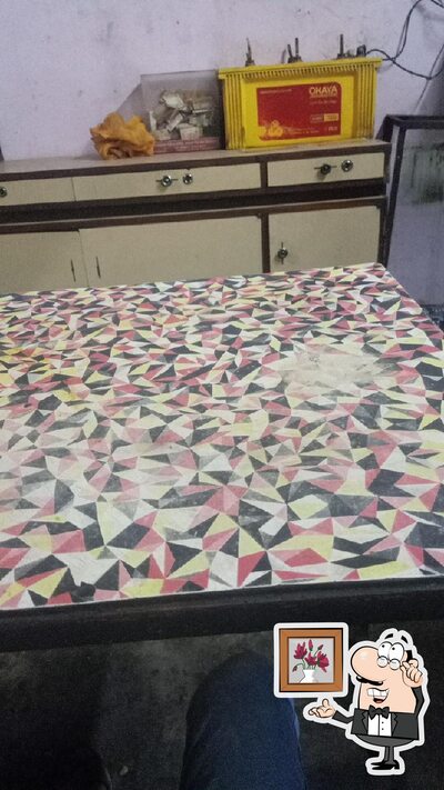 Take a seat at one of the tables at Bhavana Fast Food