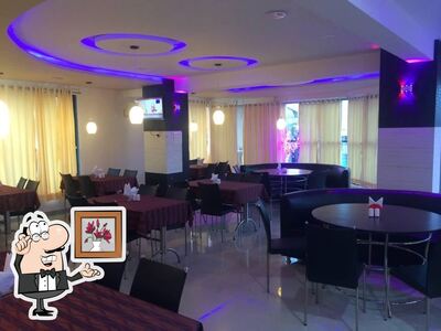 Take a seat at one of the tables at Platinum Restaurant & Cafe