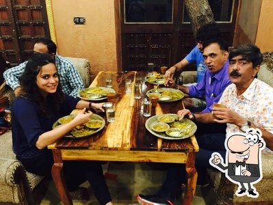 Take a seat at one of the tables at Khana
