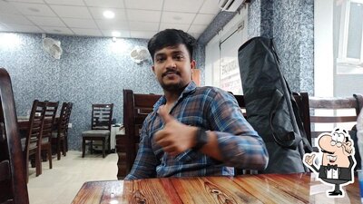 Take a seat at one of the tables at Madras Cafe