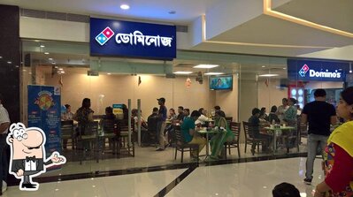 Take a seat at one of the tables at Domino's Pizza, Forum Rangoli Mall, Belur