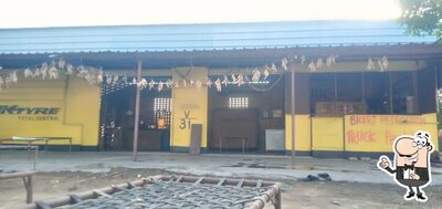 Take a seat at one of the tables at Haryana Rajasthan Dhaba