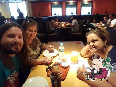 Sente em uma das mesas no Outback Steakhouse
