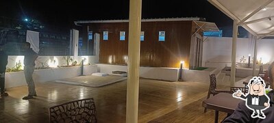 Take a seat at one of the tables at Mission Shakti Cafe