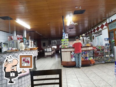 Sente em uma das mesas no Boa Vista