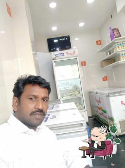 Take a seat at one of the tables at Ramugoud HAP daily arokya milk dairy