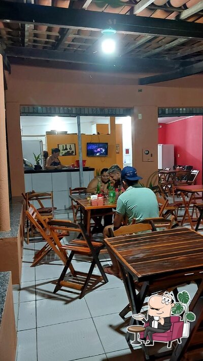 Sente em uma das mesas no Pizzaria Humaitá