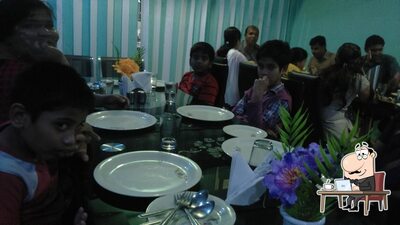 Take a seat at one of the tables at Akshaya Family Restaurant-Godavarikhani City