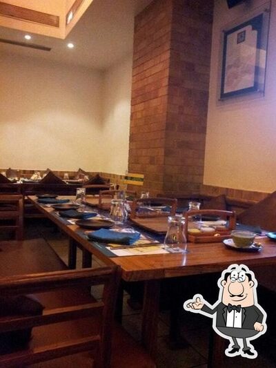 Take a seat at one of the tables at Barbeque Nation