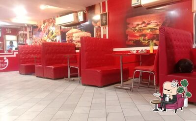 Take a seat at one of the tables at Da Pizza Inn - Hisar
