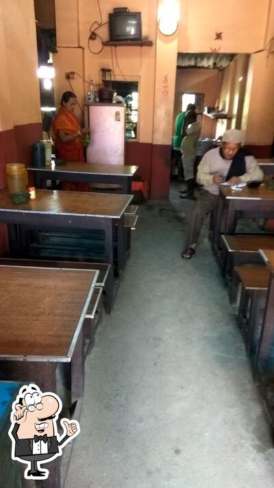 Take a seat at one of the tables at Bapidar Hotel