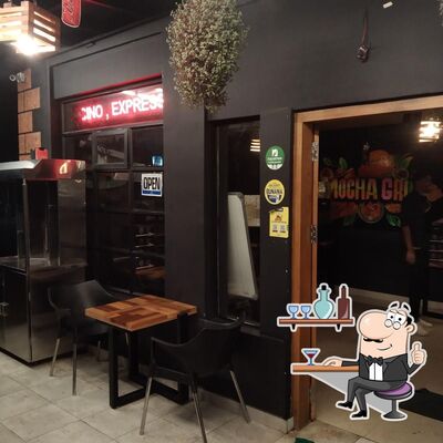 Take a seat at one of the tables at MOCHA GRILL BBQ CAFE