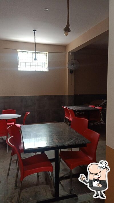 Take a seat at one of the tables at SRR MRP & RESIDENCY