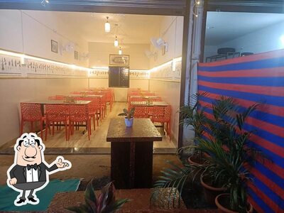Check out how Hotel Kolhapuri चुलीवरील मटन भाकरी तांबडा पांढरा रस्सा looks inside