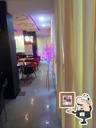 Take a seat at one of the tables at Platinum Restaurant & Cafe