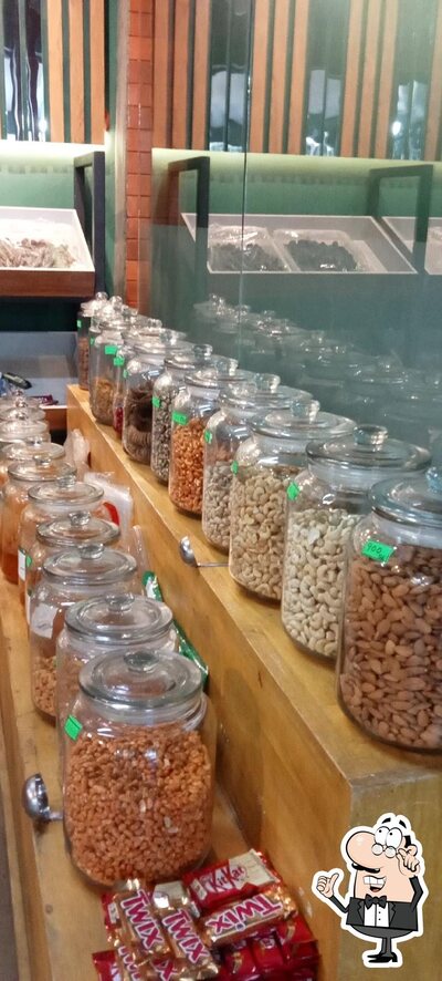 Take a seat at one of the tables at KL Fruits & Cool Bar