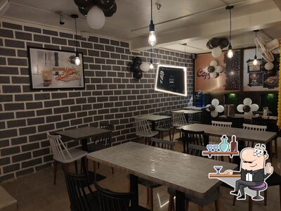 Take a seat at one of the tables at HELLY CHILLY CAFE Bagalkot The best cafe