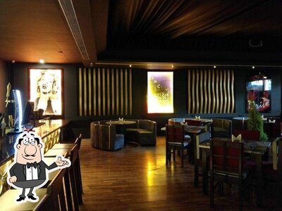 Take a seat at one of the tables at TIP-C Resto Lounge
