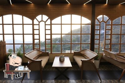 Take a seat at one of the tables at Wild Flower Sky Lounge & Dine in