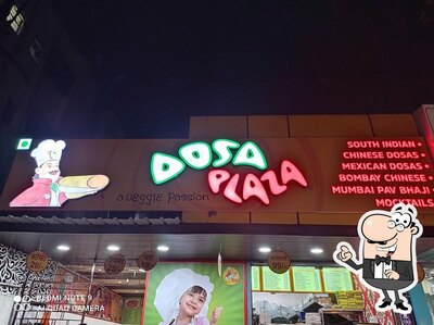 Take a seat at one of the tables at Dosa Plaza Hadapsar
