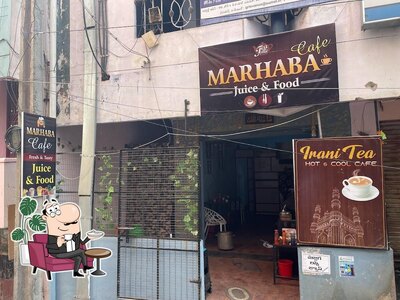 Take a seat at one of the tables at Marhaba food & juices