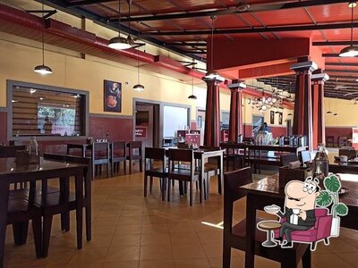 Take a seat at one of the tables at Gokul Oottupura Vegetarian - NH Bypass, Padivattom, Edappally