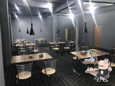 Take a seat at one of the tables at Masterchef Restaurant