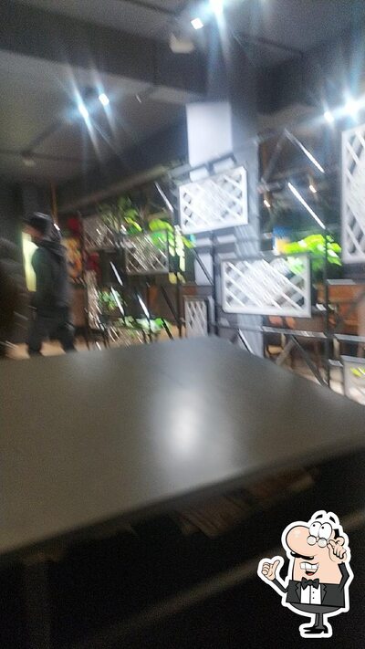 Take a seat at one of the tables at Mayra Restoran