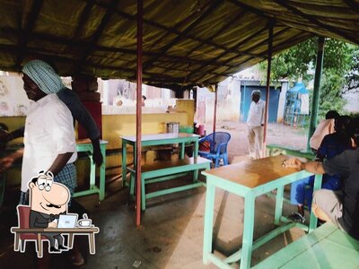 Take a seat at one of the tables at Sai Balaji Tea Point
