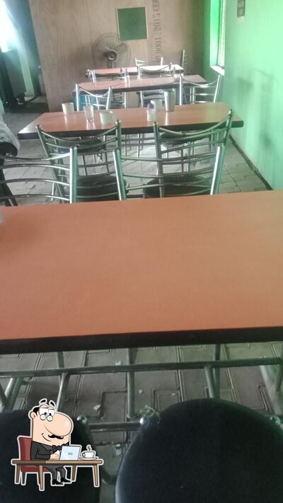 Take a seat at one of the tables at Jai Shiri Ram Family Daba