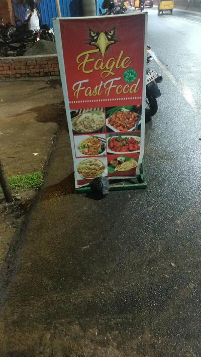 The advertisement shows information about Eagle Fast Food