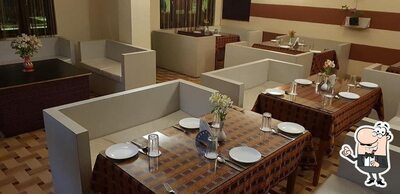 Take a seat at one of the tables at Melting Point Restobar