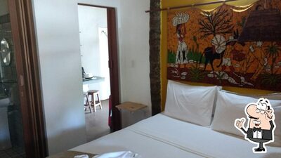 Sente em uma das mesas no Pousada Barra Velha