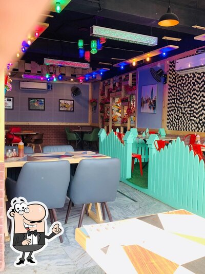 Take a seat at one of the tables at Hello Food