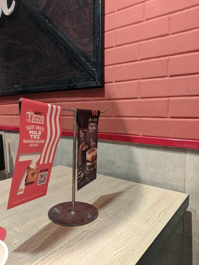 The advertisement displays information about KFC