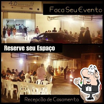 Sente em uma das mesas no 4.0 Pizzaria Delivery