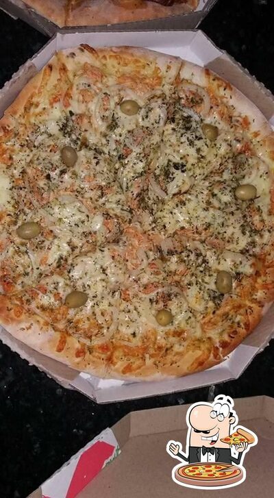 No Pizzaria bella pizza, você pode desfrutar de pizza