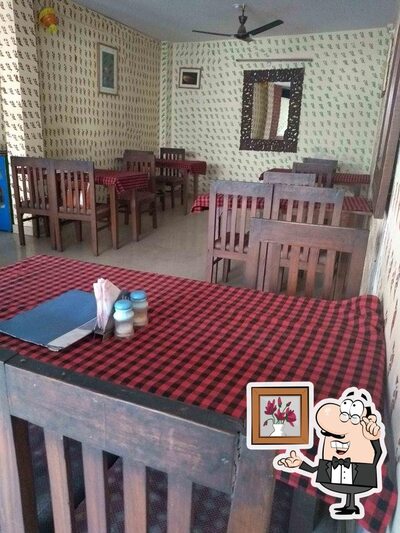 Take a seat at one of the tables at Aanchal Restaurant