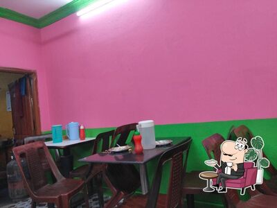 Take a seat at one of the tables at EVEREST FAST FOOD CENTER